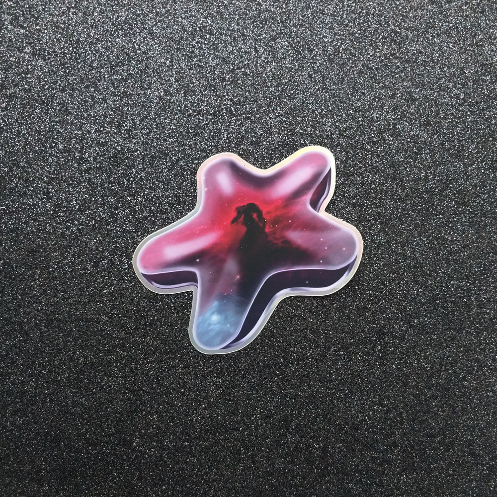 Photo of a star-shaped sticker with the horsehead nebula within